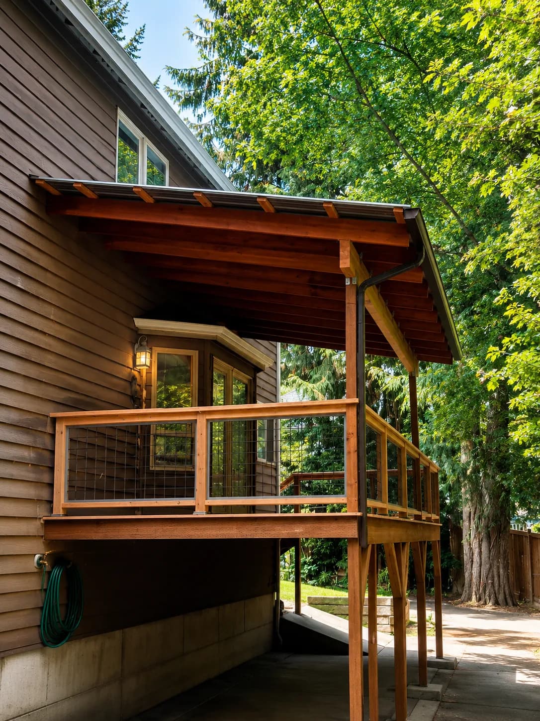 Cedar-roofed covered deck with warm wood beams in the Pacific Northwest